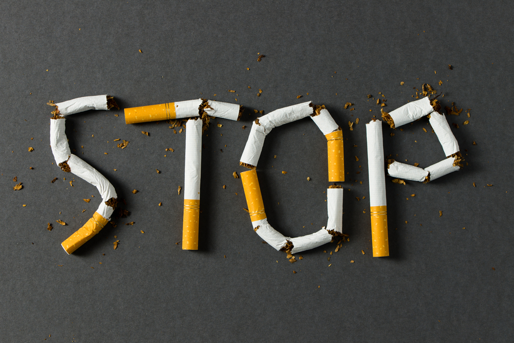 The,Word,Stop,Spelled,Using,Cigarettes,On,Black,Background