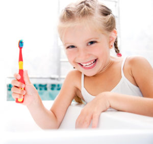 Little,Girl,Brushing,Teeth,In,Bath